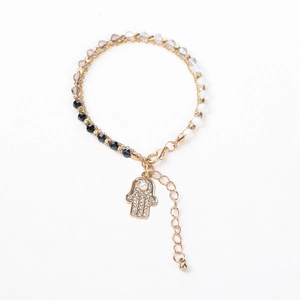 Detail of beaded Hamsa hand bracelet with multi-color crystals and adjustable gold chain