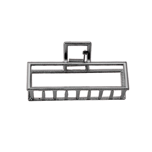 Detailed view of the sleek gunmetal rectangular metal hair claw clip with strong spring