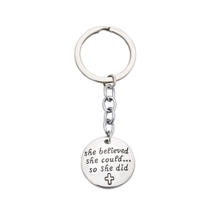 Keyring with engraved She Believed She Could motivational quote and a small cross