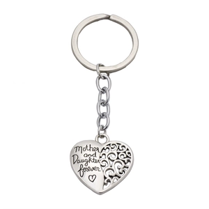 Detailed close-up of heart-shaped keychain with Mother and Daughter forever engraving