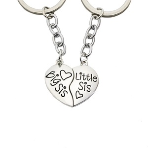 Polished silver heart puzzle keychain set with Big Sis and Little Sis engraving