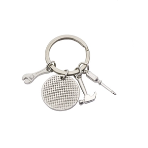 Polished silver metal keychain with miniature wrench, hammer and screwdriver tools