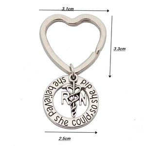 Detail of silver nurse keychain with RN caduceus charm and heart ring measurements