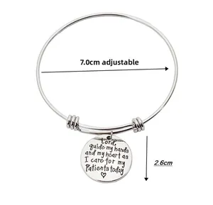 Detail view of adjustable silver bracelet with 2.6cm engraved pendant and size markings