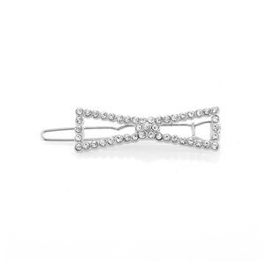 Detailed macro view of a silver rhinestone bow hair clip with clear crystals decoration