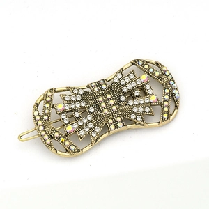 Vintage geometric metal hair clip with rhinestones and sparkling crystals on white background