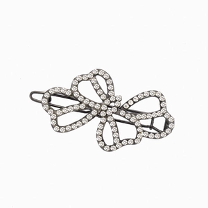 Sparkling crystal butterfly hair clip with dark gunmetal base and clear rhinestones