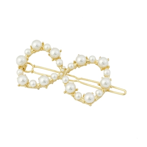 Barrette à cheveux dorée infini avec perles blanches sur une base métallique géométrique