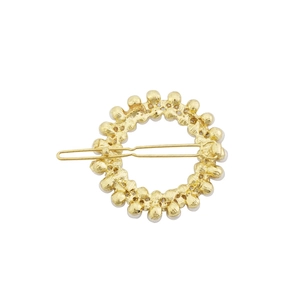 Barrette ronde dorée avec perles et strass vue de dos montrant le clip métallique