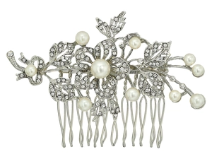 Detailed close-up of bridal hair comb with crystal flowers and white pearls decoration