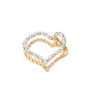 Détail d'une pince à cheveux en forme de cœur dorée avec perles et strass brillants