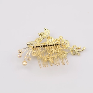 Detailed view of a golden flower bridal hair comb with elegant rhinestone leaf designs