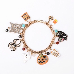 Halloween charm bracelet featuring gold chain with pumpkin ghost and spider pendants