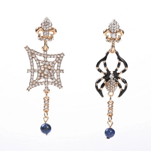 Asymmetric Halloween spider and web earrings with gold iris studs and blue beads