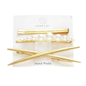 Elegant 4-piece gold hair clip set with white pearls on a jewelry display card