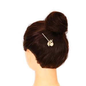 Golden starfish and conch hair clip set on a model back view, ocean style accessory