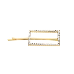 Detail of a rectangular gold-tone hair clip featuring a perimeter of sparkling white rhinestones