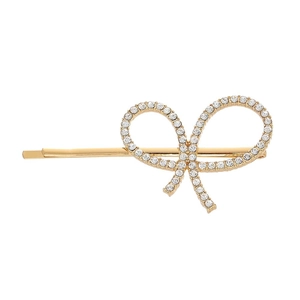 Close-up of golden alloy bow hair clip with sparkling white rhinestones on white background