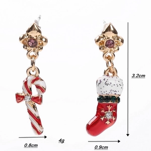 Detail showing asymmetric Christmas earrings with candy cane, stocking and sparkly rhinestones