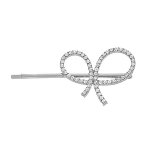 Close-up of silver metal hair clip with a large bow design fully set with sparkling crystals