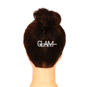 Sparkling silver GLAM letter hair clip on dark bun hairstyle for a minimalist chic look