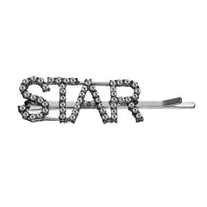 Detailed close-up of a silver hair clip featuring star letters and shiny rhinestones