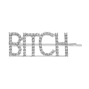Detailed view of silver-plated bobby pin featuring sparkling rhinestone-studded letters