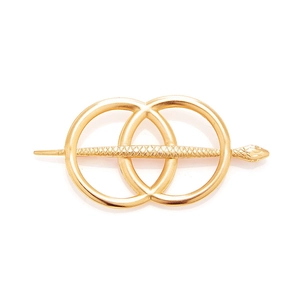 Golden alloy hair clip featuring circular geometric rings and a textured snake pin design