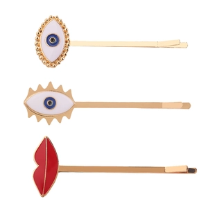 Three-piece set of Evil Eye and red lips hair clips in gold finish with enamel details