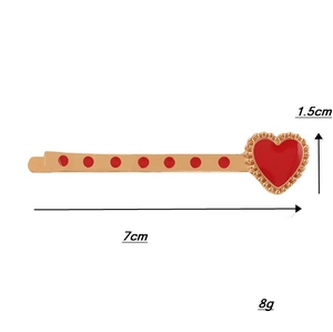 Vintage punk style red heart hair clip with gold metal base and 7cm length scale detail