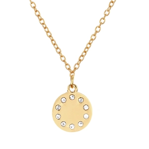 Gros plan d'un collier pendentif rond doré poli avec des strass blancs étincelants