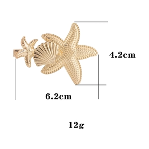 Golden starfish and seashell hair clip with ocean theme design and size markings