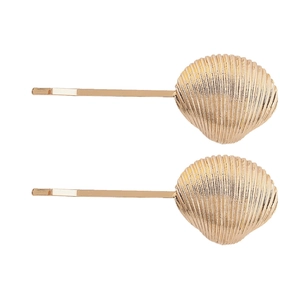 Lot de deux pinces à cheveux en alliage doré motif coquillage au design marin épuré
