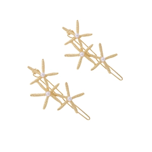 Set of two gold starfish hair clips with elegant pearls for ocean themed styling