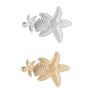 Starfish and seashell hair clip set in gold and silver metal with textured finish