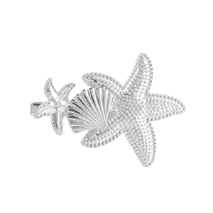 Silver starfish and seashell alloy hair clip with ocean theme and detailed metal texture