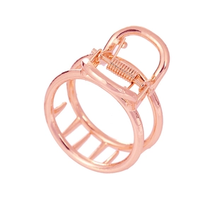 Minimalist rose gold alloy hair claw clip featuring a sleek hollow circular design