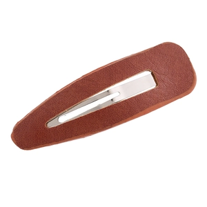 Close-up of vintage brown PU leather leopard pattern hair clip with metal BB snap