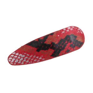 Close-up detail of the red and black faux leather snakeskin texture on teardrop hair clip