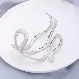 Silver snake arm cuff featuring realistic textured scales on a wrap-around metal design