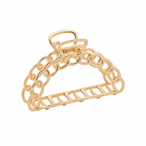 Golden hollow chain link metal hair claw clip with polished finish on white background