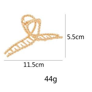 Detailed size specifications of the gold twisted hair claw clip showing 11.5cm width and 5.5cm height