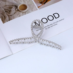 Elegant silver twisted metal hair claw clip with minimalist braided design for women