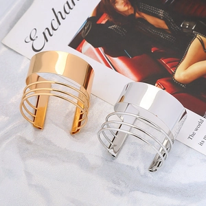 Fashion punk wide cuff bracelets in gold and silver metal with hollow cutout design