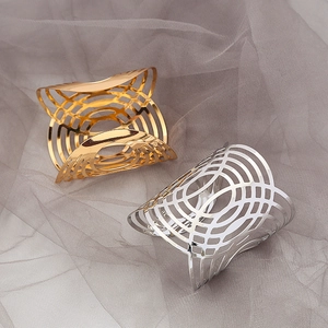 Elegant gold and silver geometric hollow napkin rings with polished metallic finish