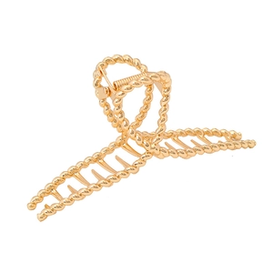 Fashionable gold twisted metal hair claw clip with a glossy finish for women's hair styling