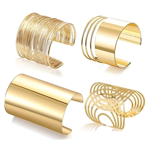 Polished gold open cuff bracelet set with geometric and minimalist textured designs