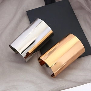 Minimalist wide cuff metallic bracelets in polished gold and silver mirror finishes