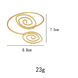 Detailed view of leaf pattern gold spiral arm cuff with dimensions 7.5cm by 8.8cm
