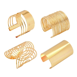 Set of four gold cuff bracelets featuring mirror finish and geometric mesh designs